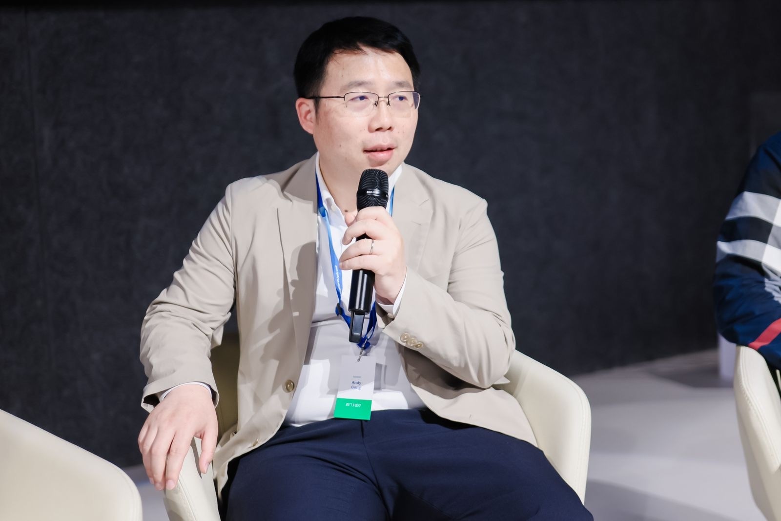 Andy Gong discussing AI technologies during the panel discussion.