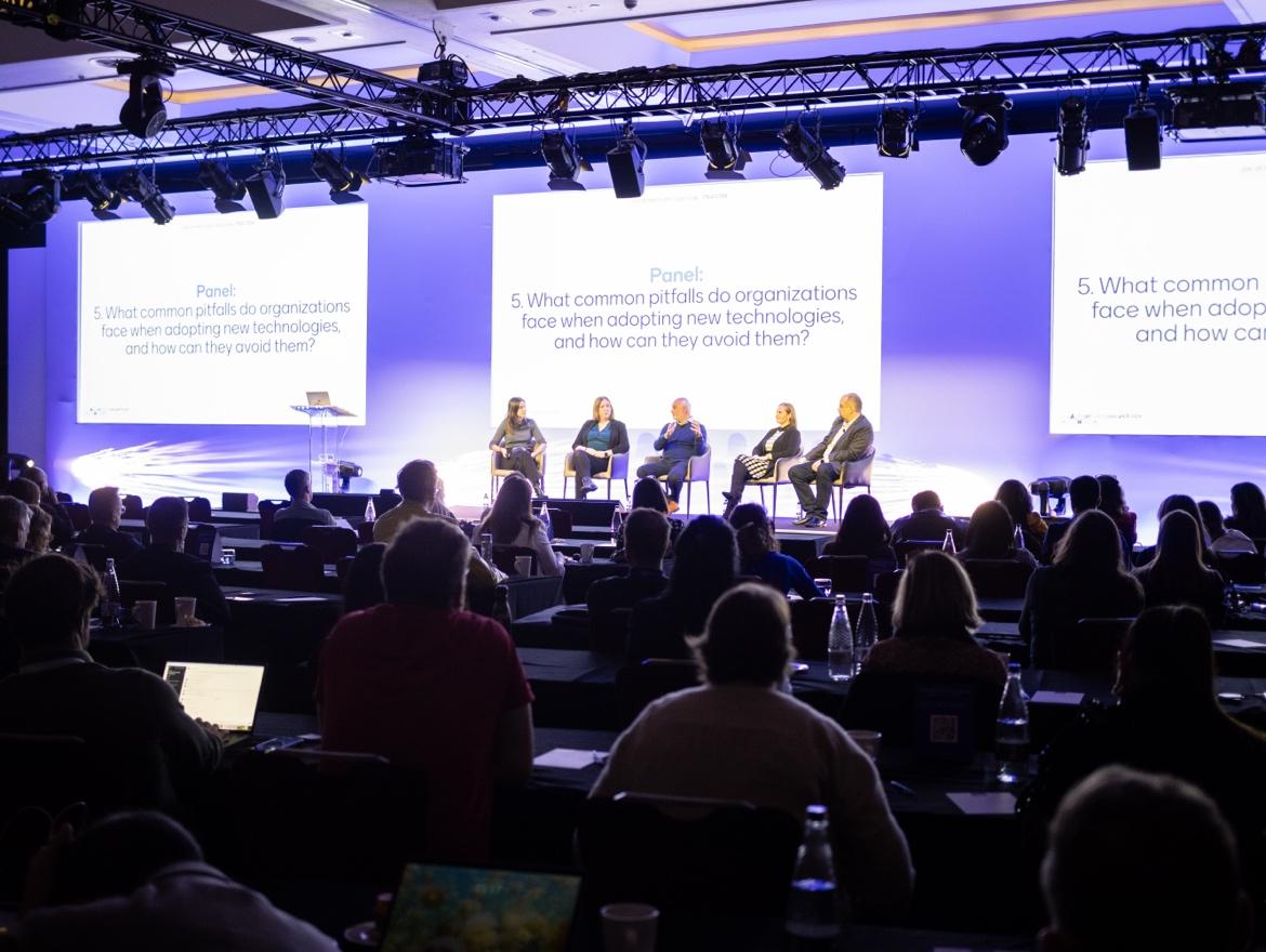 The audience watching industry leaders discuss the future of talent during a lively panel session